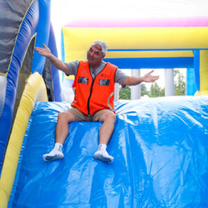 Certified event safety officer overseeing The Gauntlet inflatable obstacle course setup in South Africa